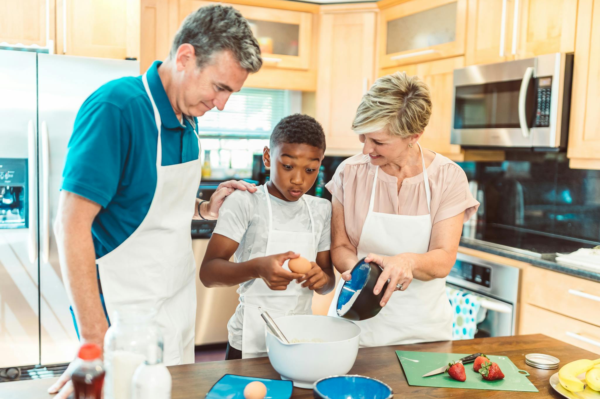 Family bonding in the kitchen while preparing a meal together with love and joy.