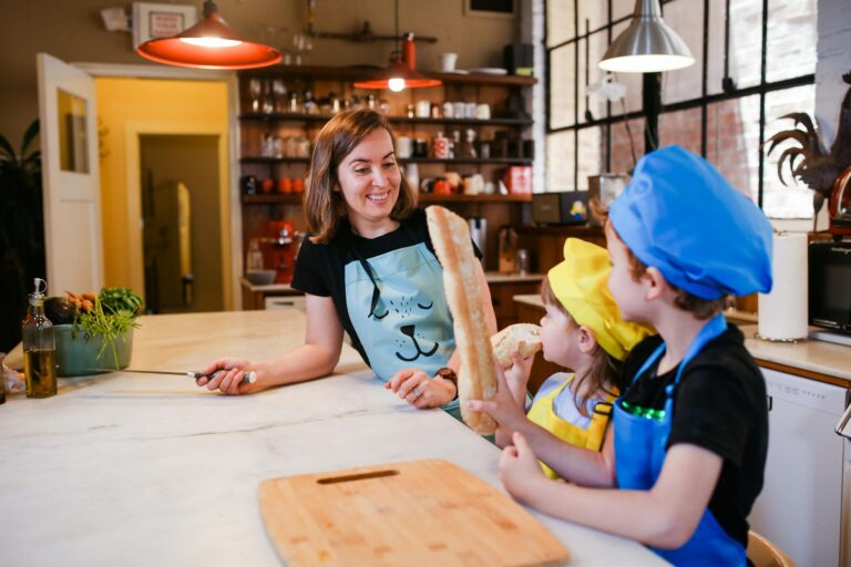 Mother and kids enjoy an engaging cooking session in a modern kitchen setting.